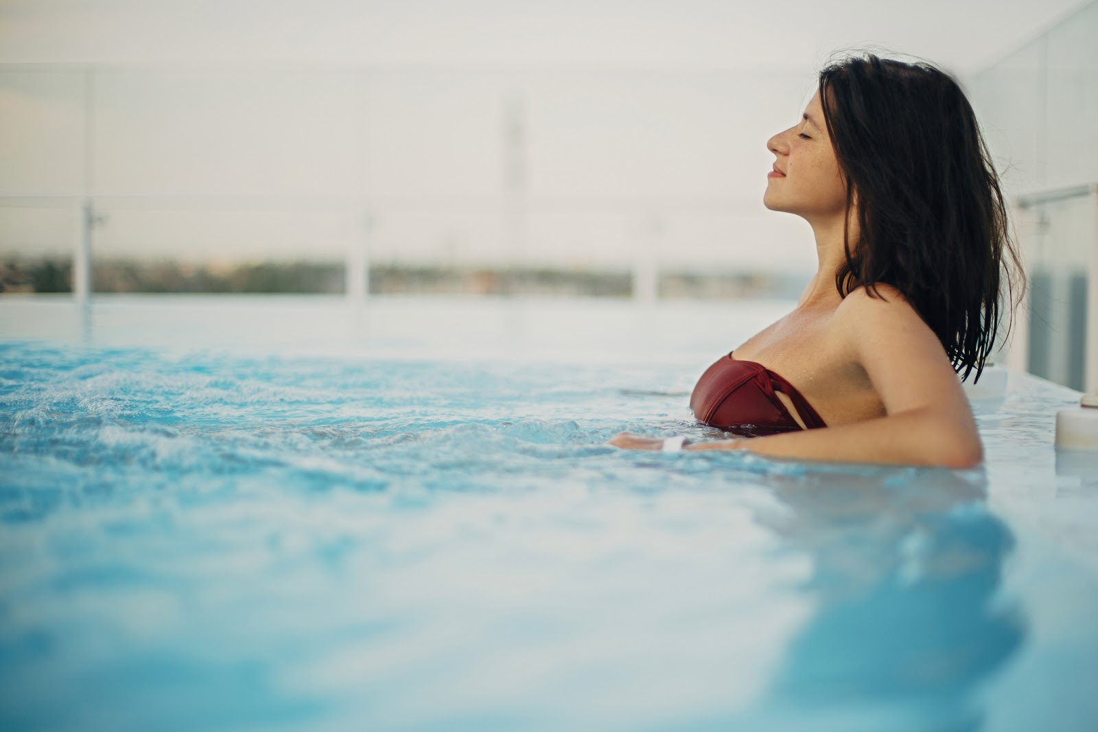 Young woman prioritizing her health and wellness in a pool