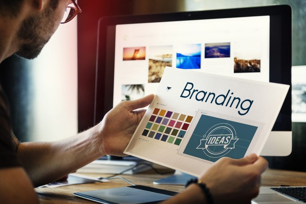A man going over branding ideas for a company